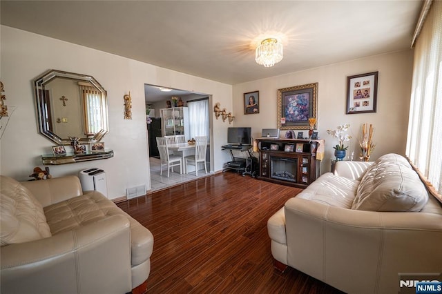 72 N Dr, Rochelle Park, NJ 07662 - living area featuring healthy amount of natural light and wood finished floors