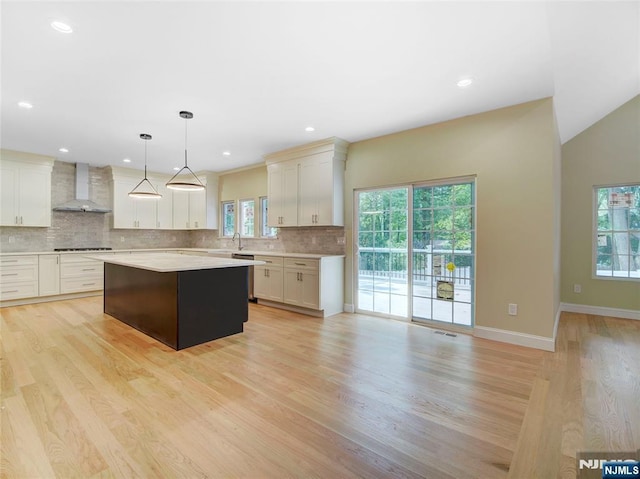 345 Creek Bed Rd, Mountainside, NJ 07092 - kitchen featuring wall chimney range hood, light countertops, plenty of natural light, tasteful backsplash, and recessed lighting