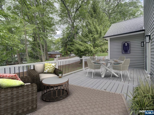 345 Creek Bed Rd, Mountainside, NJ 07092 - wooden deck featuring outdoor dining area, view of wooded area, and an outdoor living space