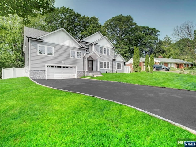345 Creek Bed Rd, Mountainside, NJ 07092 - view of front of home with a garage, driveway, and board and batten siding