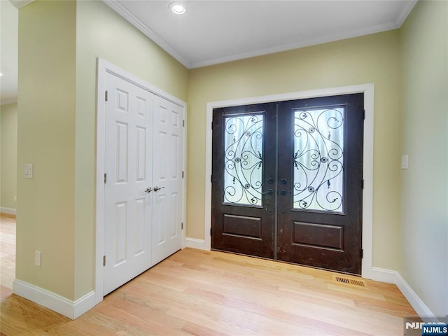 345 Creek Bed Rd, Mountainside, NJ 07092 - foyer entrance with french doors, light wood-type flooring, crown molding, and recessed lighting