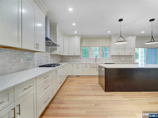 345 Creek Bed Rd, Mountainside, NJ 07092 - kitchen featuring wall chimney exhaust hood, plenty of natural light, light wood finished floors, white cabinetry, and recessed lighting