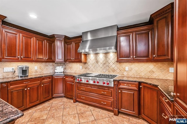 82 Jackson Dr, Cresskill, NJ 07626 - kitchen with wall chimney exhaust hood, stainless steel gas cooktop, tasteful backsplash, dark stone countertops, and recessed lighting