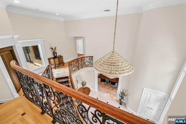 82 Jackson Dr, Cresskill, NJ 07626 - stairs with ornamental molding, recessed lighting, a high ceiling, wood finished floors, and a chandelier