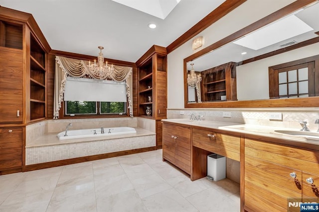 82 Jackson Dr, Cresskill, NJ 07626 - bathroom featuring marble finish floors, a chandelier, a skylight, and recessed lighting