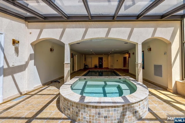 82 Jackson Dr, Cresskill, NJ 07626 - indoor pool with a hot tub and a patio area