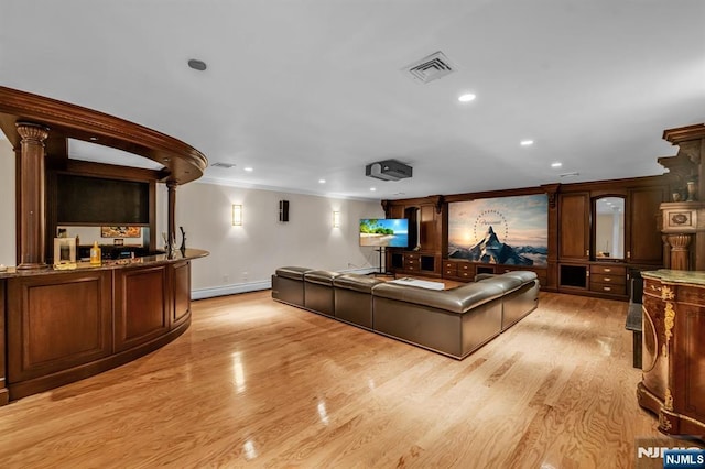 82 Jackson Dr, Cresskill, NJ 07626 - living area with a baseboard heating unit, crown molding, light wood-style flooring, and recessed lighting