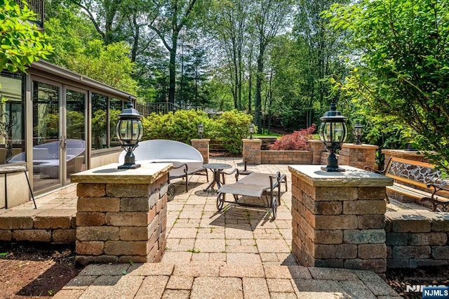 82 Jackson Dr, Cresskill, NJ 07626 - view of patio featuring view of wooded area