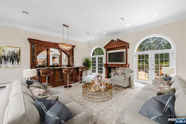 82 Jackson Dr, Cresskill, NJ 07626 - living area featuring french doors, a dry bar, healthy amount of natural light, recessed lighting, and crown molding