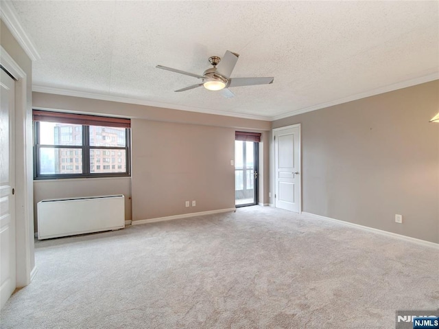 250 Gorge Rd Unit 16D, Cliffside Park, NJ 07010 - empty room with a textured ceiling, ornamental molding, ceiling fan, radiator heating unit, and carpet