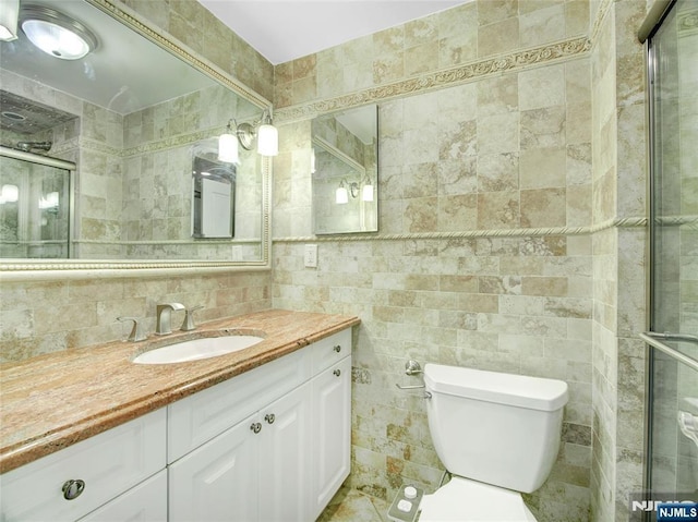 250 Gorge Rd Unit 16D, Cliffside Park, NJ 07010 - bathroom with tile walls, vanity, and a shower stall