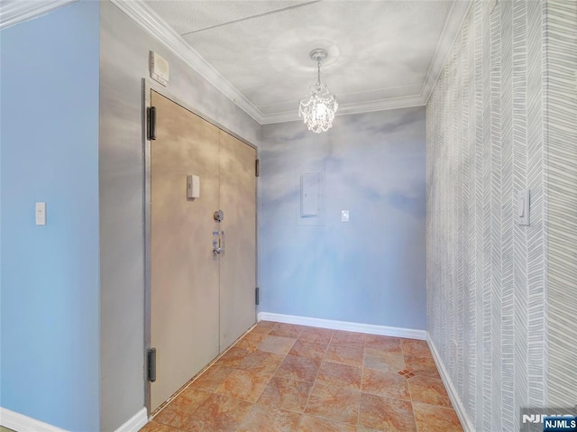 250 Gorge Rd Unit 16D, Cliffside Park, NJ 07010 - corridor with ornamental molding, a chandelier, and light stone finish floors
