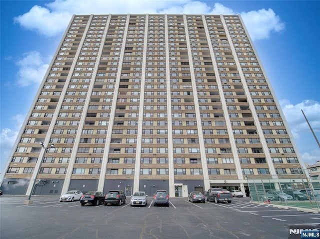 250 Gorge Rd Unit 16D, Cliffside Park, NJ 07010 - view of building exterior featuring uncovered parking