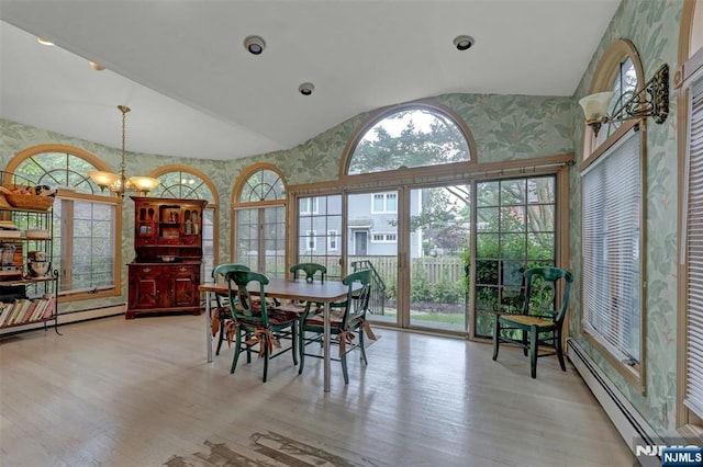 548 Standish Rd, Teaneck, NJ 07666 - dining room with wallpapered walls, plenty of natural light, wood finished floors, a baseboard radiator, and high vaulted ceiling