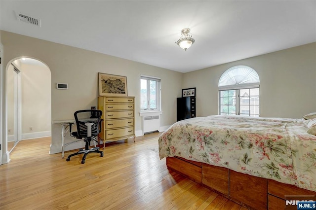 548 Standish Rd, Teaneck, NJ 07666 - bedroom with radiator and light wood-style flooring
