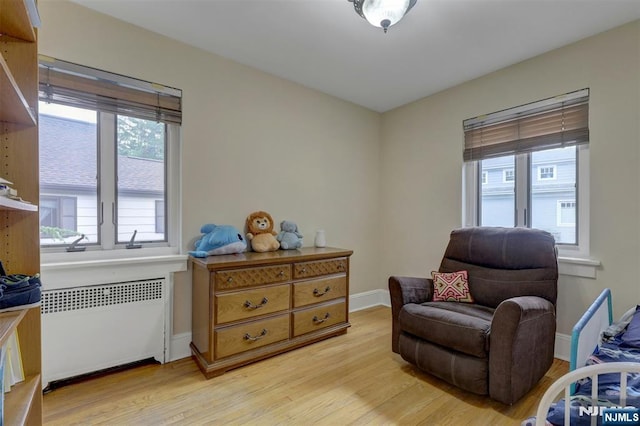 548 Standish Rd, Teaneck, NJ 07666 - sitting room featuring radiator and light wood-style floors