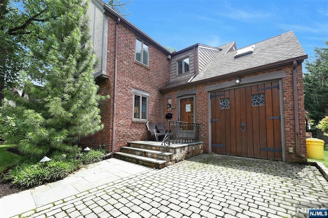 548 Standish Rd, Teaneck, NJ 07666 - rear view of property featuring brick siding and a patio
