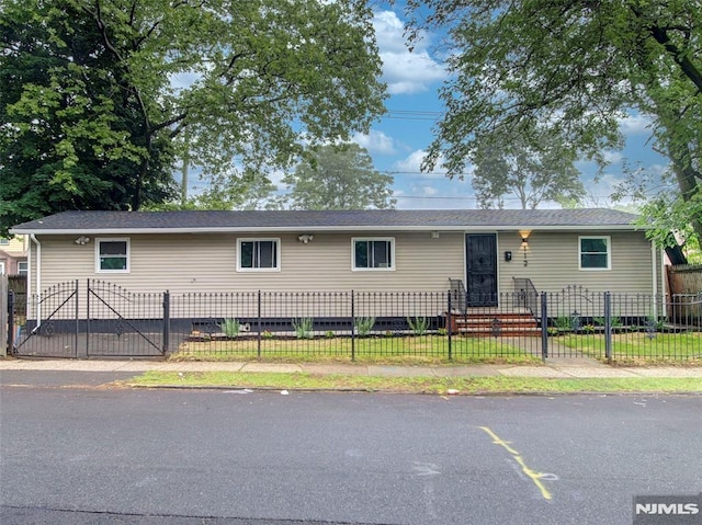112-122 Halsted, Newark, NJ 07106 - view of front facade with crawl space, a gate, and a fenced front yard