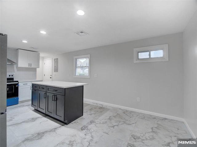 112-122 Halsted, Newark, NJ 07106 - kitchen with electric range oven, light marble finish floors, wall chimney exhaust hood, light countertops, and recessed lighting
