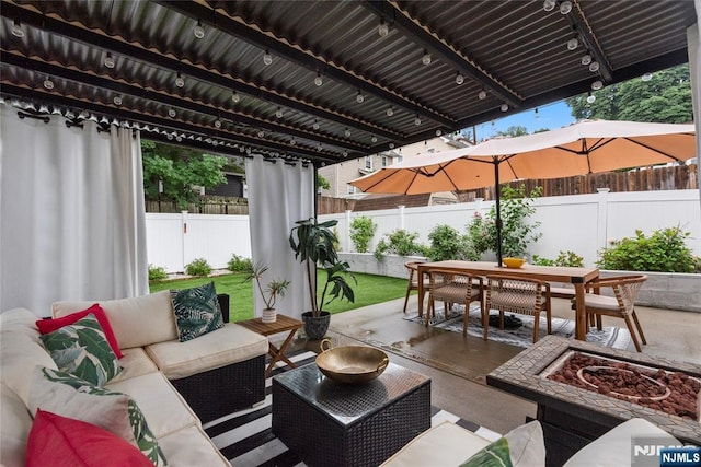 19 Mckinley Ave, West Orange, NJ 07052 - fenced backyard with an outdoor living space with a fire pit, outdoor dining space, and a patio