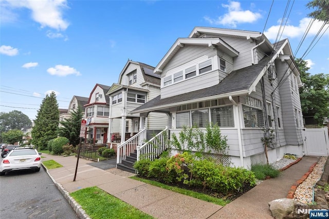 19 Mckinley Ave, West Orange, NJ 07052 - view of front of home featuring a gate and roof with shingles