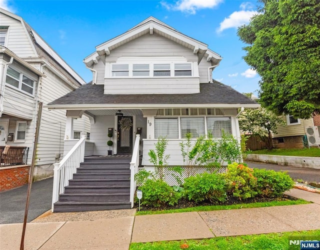 19 Mckinley Ave, West Orange, NJ 07052 - view of front of house featuring a porch and a shingled roof