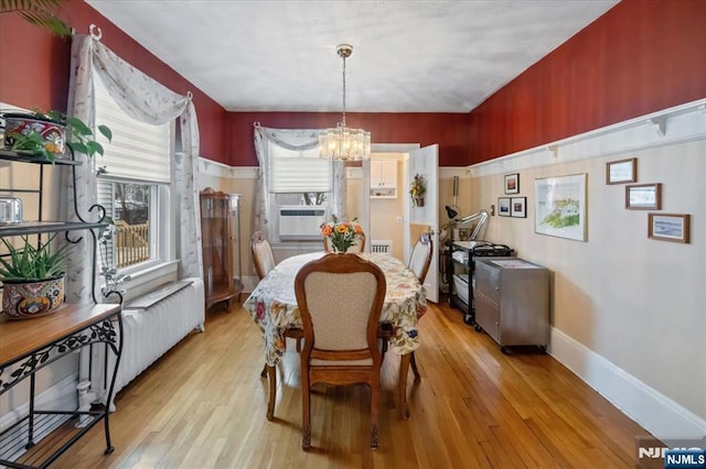 460 River Rd, Bogota, NJ 07603 - dining area with a chandelier, light wood finished floors, and cooling unit
