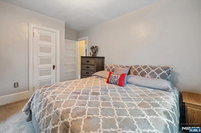 460 River Rd, Bogota, NJ 07603 - carpeted bedroom with baseboards