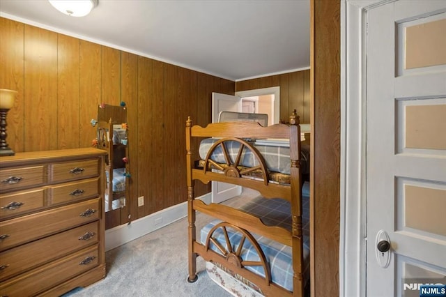 460 River Rd, Bogota, NJ 07603 - bedroom featuring light carpet, wood walls, and ornamental molding