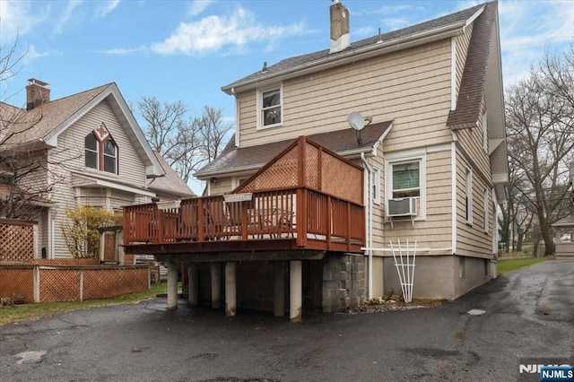 460 River Rd, Bogota, NJ 07603 - back of property featuring a wooden deck, a chimney, cooling unit, and a shingled roof
