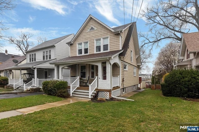 460 River Rd, Bogota, NJ 07603 - view of front of property featuring a porch, a front yard, and roof with shingles