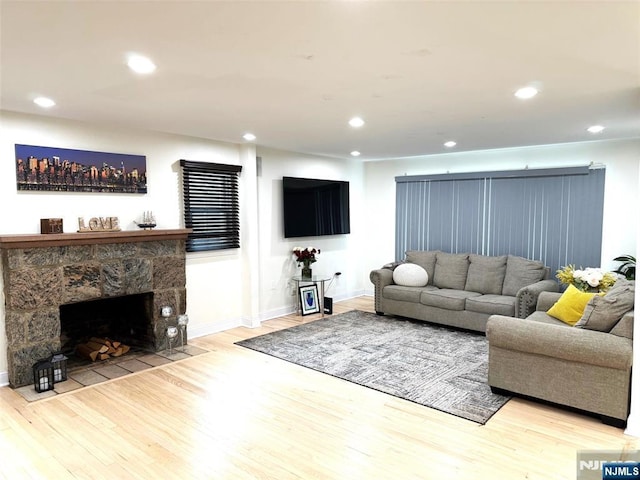 45 Highland Ave, Emerson, NJ 07630 - living room with wood finished floors, recessed lighting, and a stone fireplace