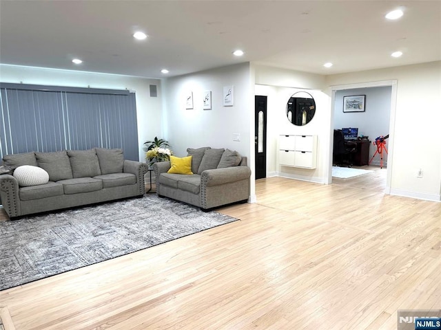 45 Highland Ave, Emerson, NJ 07630 - living room with light wood-style floors and recessed lighting