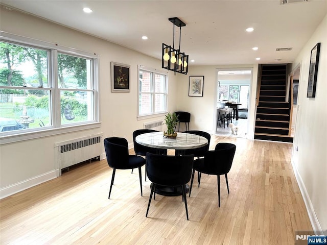 45 Highland Ave, Emerson, NJ 07630 - dining area featuring radiator heating unit, light wood finished floors, healthy amount of natural light, and recessed lighting