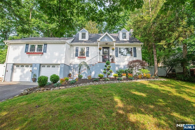 40 Lake Dr, Wayne, NJ 07470 - cape cod home with asphalt driveway, an attached garage, and a front lawn