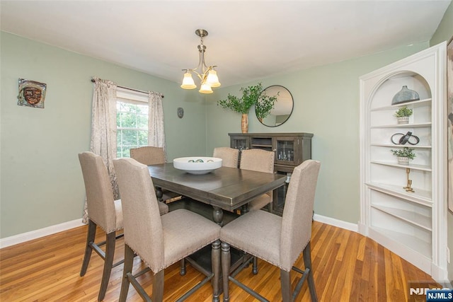 40 Lake Dr, Wayne, NJ 07470 - dining area with a chandelier, light wood finished floors, and built in features
