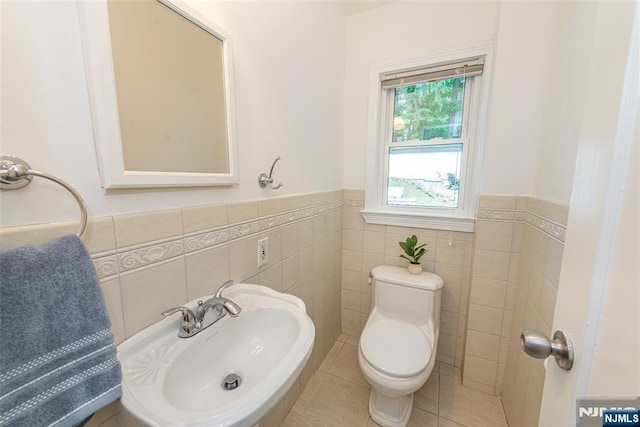 40 Lake Dr, Wayne, NJ 07470 - half bath with tile walls, a wainscoted wall, and tile patterned floors
