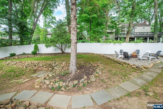 40 Lake Dr, Wayne, NJ 07470 - fenced backyard with an outdoor fire pit and a wooden deck