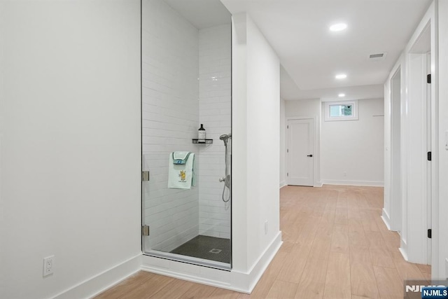 44 N Ashby Ave, Livingston, NJ 07039 - bathroom featuring wood finished floors, a stall shower, and recessed lighting