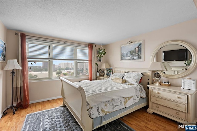 555 N Ave Unit 15W, Fort Lee, NJ 07024 - bedroom featuring light wood-type flooring and a textured ceiling