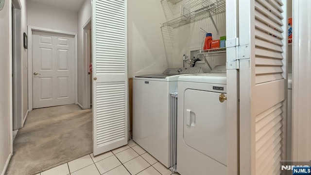 2 Richmond Rd Unit 306, West Milford, NJ 07480 - washroom featuring washing machine and clothes dryer, light tile patterned floors, and light carpet