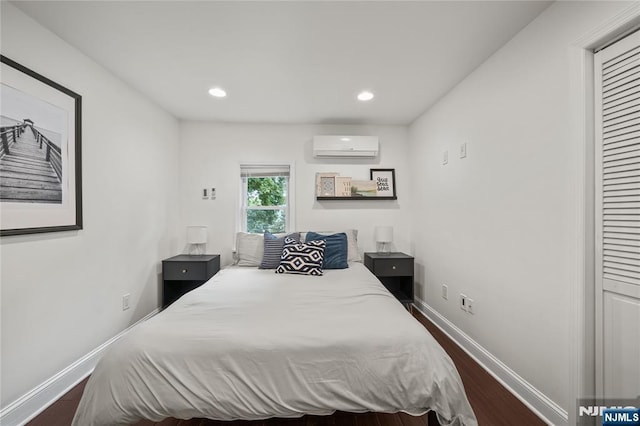 18 Lee Ave, Jefferson Township, NJ 07849 - bedroom featuring a wall mounted AC, dark wood-style flooring, and recessed lighting