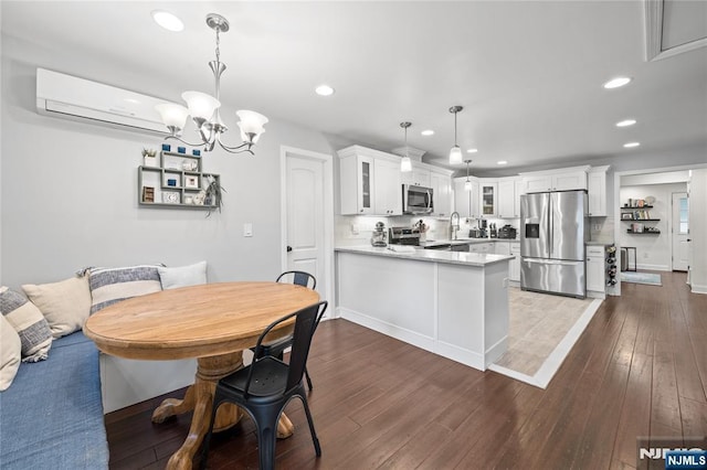 18 Lee Ave, Jefferson Township, NJ 07849 - dining space with recessed lighting, a wall mounted air conditioner, dark wood-type flooring, and a chandelier