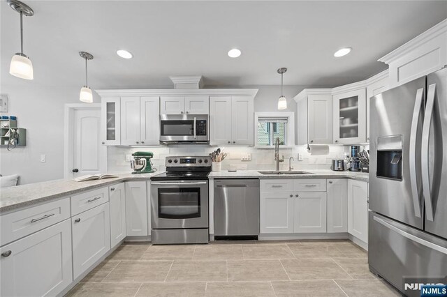 18 Lee Ave, Jefferson Township, NJ 07849 - kitchen featuring stainless steel appliances, backsplash, white cabinetry, and recessed lighting