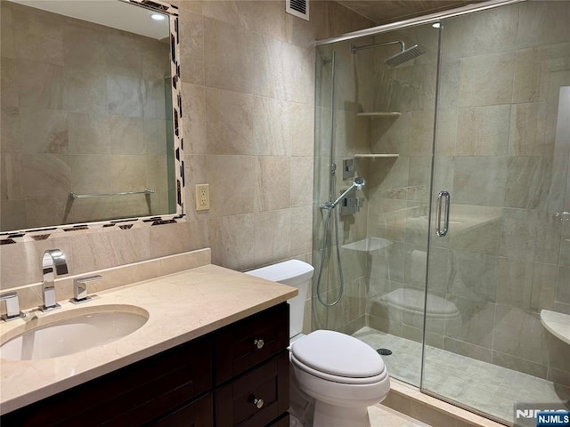 6 Horizon Rd Unit 604, Fort Lee, NJ 07024 - bathroom featuring tile walls, vanity, a stall shower, and tasteful backsplash