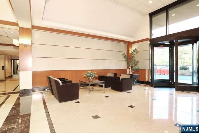 6 Horizon Rd Unit 604, Fort Lee, NJ 07024 - lobby featuring a high ceiling, wood walls, and recessed lighting