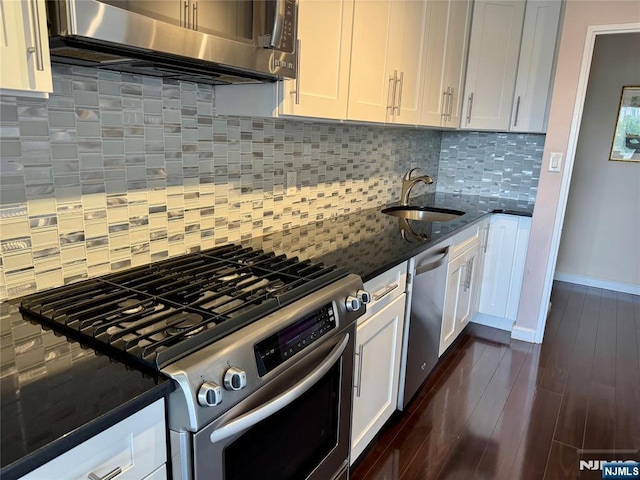 6 Horizon Rd Unit 604, Fort Lee, NJ 07024 - kitchen featuring appliances with stainless steel finishes, dark stone countertops, and white cabinets