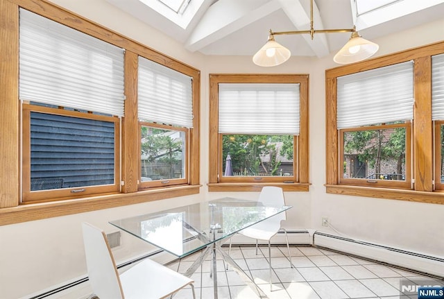 518 Standish Rd, Teaneck, NJ 07666 - dining space with plenty of natural light, a skylight, light tile patterned floors, vaulted ceiling, and baseboard heating