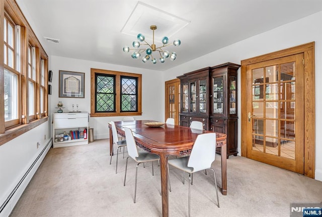 518 Standish Rd, Teaneck, NJ 07666 - dining area featuring a baseboard radiator, light carpet, plenty of natural light, and a chandelier