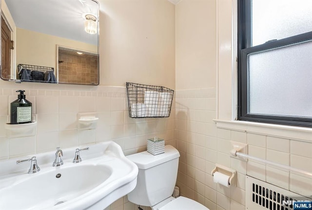 518 Standish Rd, Teaneck, NJ 07666 - bathroom with radiator heating unit, plenty of natural light, and tile walls